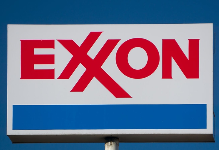 Exxon reports a historic loss while Chevron deepens cuts